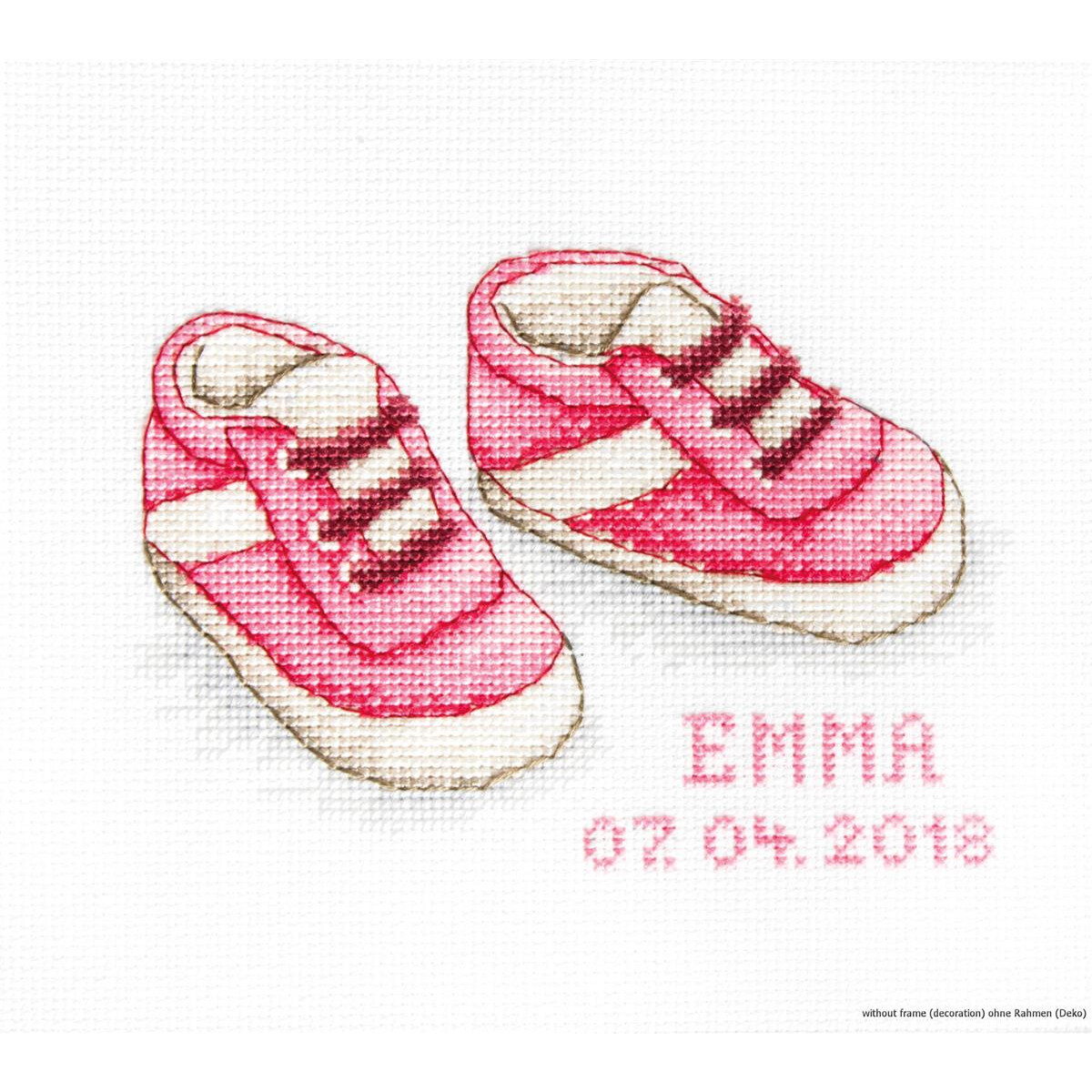 Cross stitch picture of pink baby shoes with white sole...