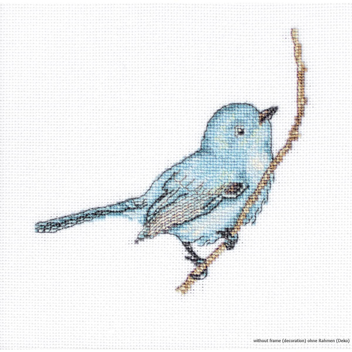 A cross stitch embroidery of a small blue bird sitting on...