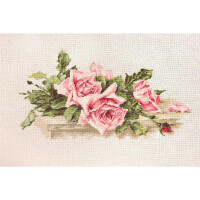 An embroidered work of art featuring a bouquet of pink roses with green leaves, carefully stitched in cross stitch on light beige fabric. This exquisite embroidery pack from Luca-s features elegantly arranged roses, some in full bloom and others as buds, creating a delicate, natural composition.