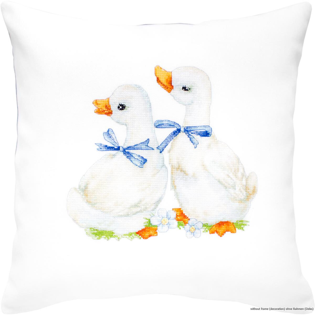 A decorative white cushion features an image of two white...