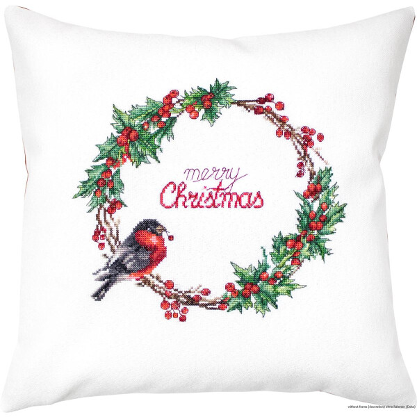 A white square cushion features an intricately embroidered design of a Christmas wreath made of green holly leaves and red berries. Merry Christmas is embroidered into the wreath in red. A realistically embroidered bird with black, white and red plumage sits on the left-hand side of this enchanting embroidery pack from Luca-s.