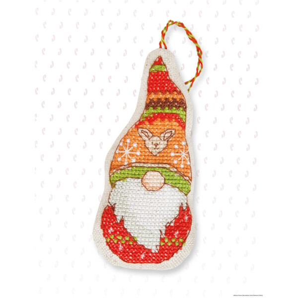 An enchanting Christmas ornament in the shape of a gnome decorated with cross-stitching. The gnome is wearing an orange and green striped hat with a reindeer logo on top. He has a white beard and is dressed in red. A red, green and yellow braided loop is attached for hanging. This embroidery pack from Luca-s creates a festive atmosphere!