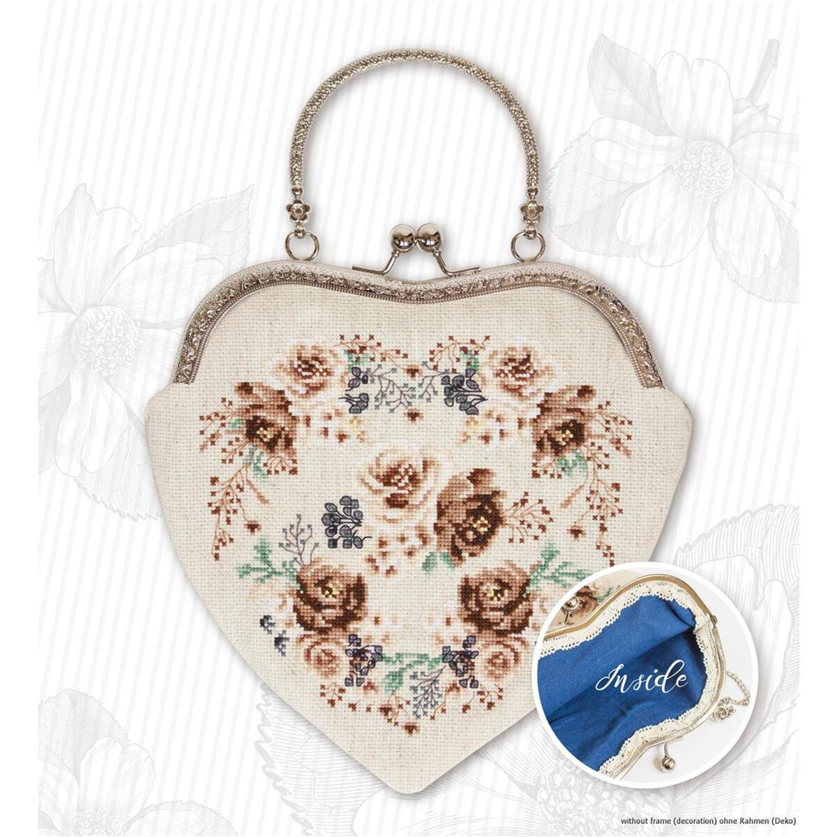 A heart-shaped handbag with a vintage metal clasp and an...