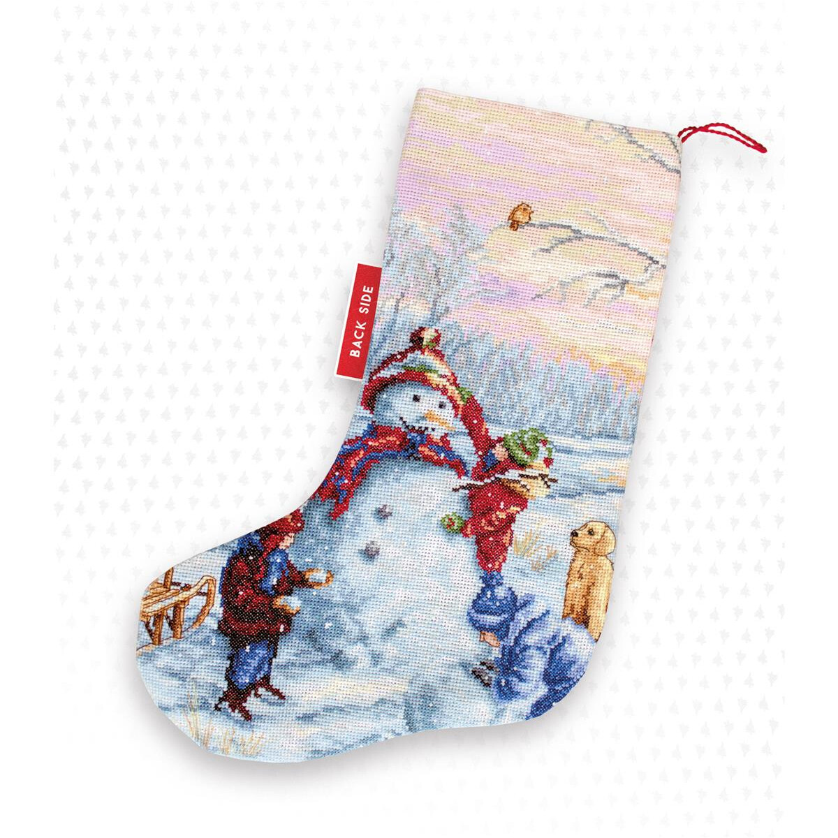 A Christmas stocking showing a winter landscape with...