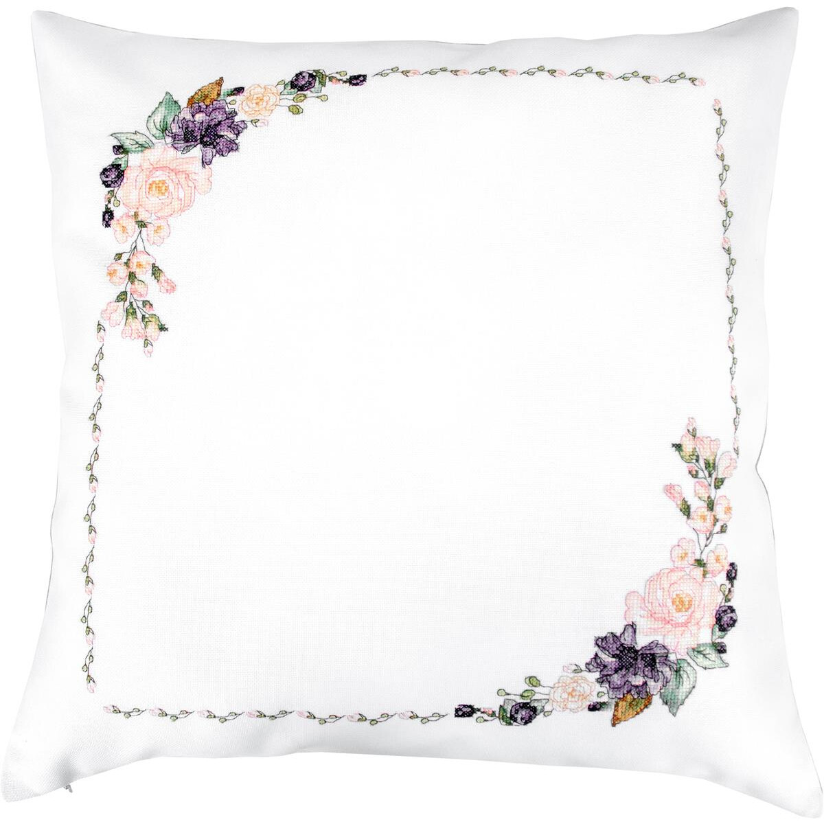 A white square cushion with floral embroidery, made from...