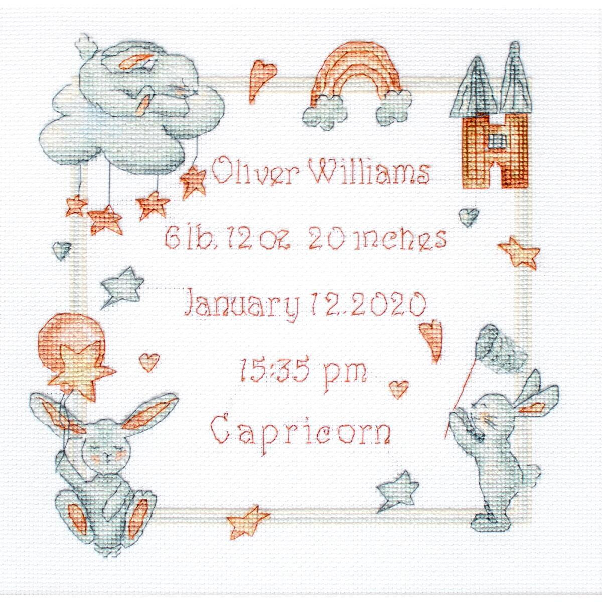 An embroidered birth announcement in cross stitch with...