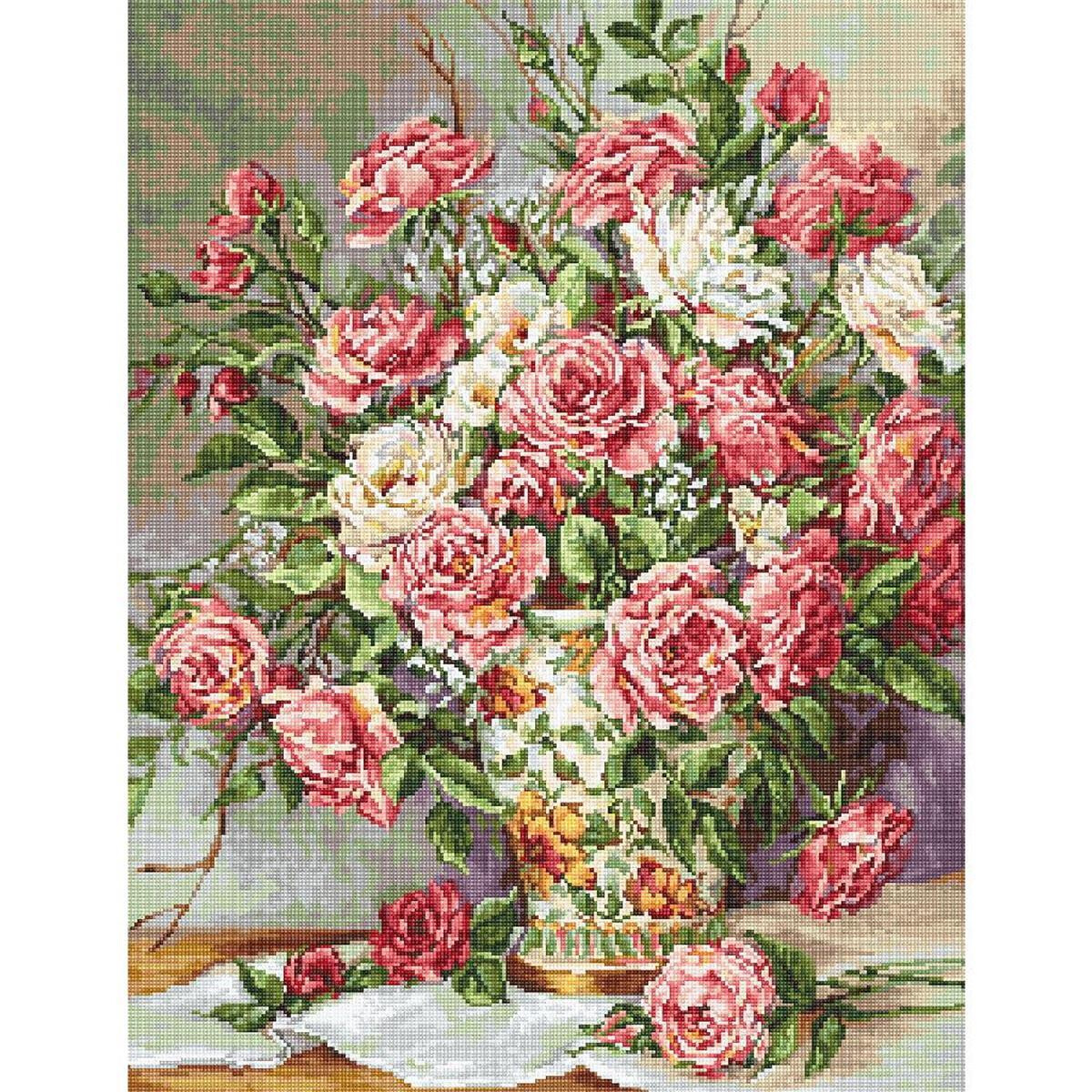 A bouquet of pink and white roses in a decorative vase...