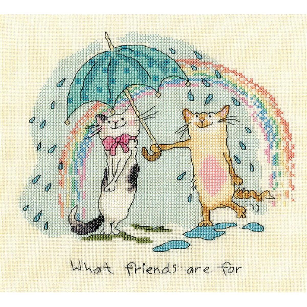 A cross-stitch picture of two smiling cats. One cat is...