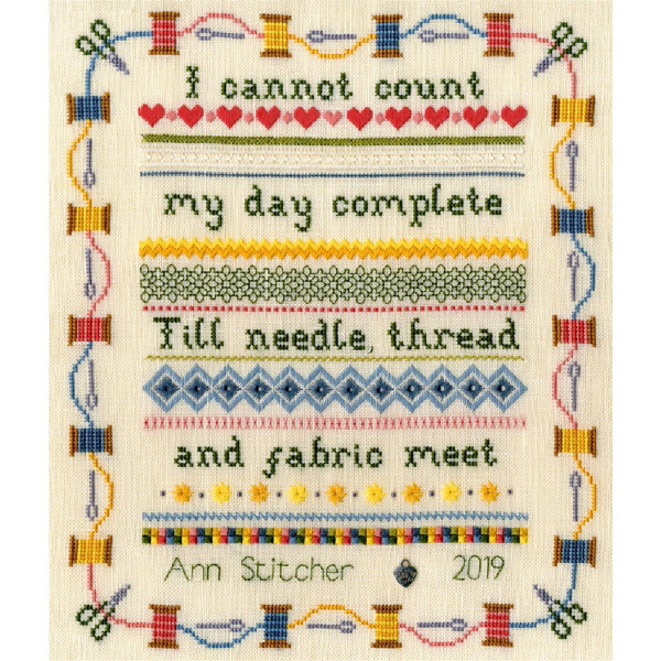 An embroidered needlepoint design with intricate stitches and colorful geometric borders, hearts and various stitch patterns features the quote, I cant consider my day complete until needle, thread and fabric come together. This beautiful embroidery pack from Bothy Threads is signed Ann Stitcher 2019 at the bottom.