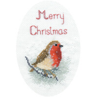 An oval embroidery pack from Bothy Threads with a robin sitting on a branch against a white background. Merry Christmas is embroidered above the bird in red thread. This cross stitch composition is festive and simple, emphasizing the holiday greeting and the bird.