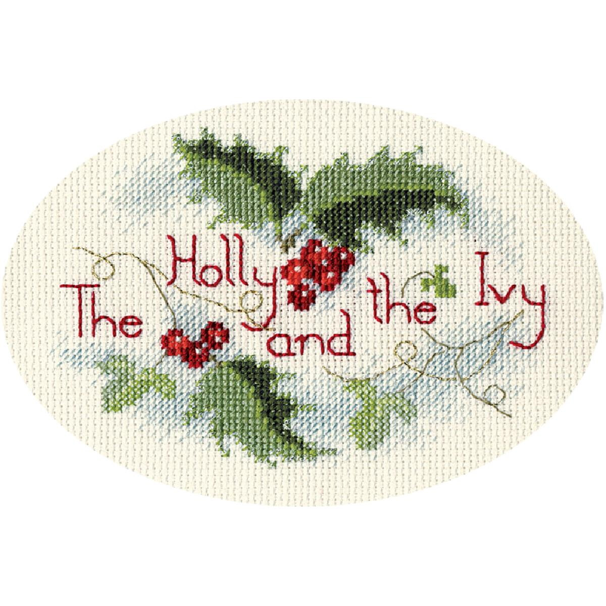 An oval cross-stitch design with the text The holly and...