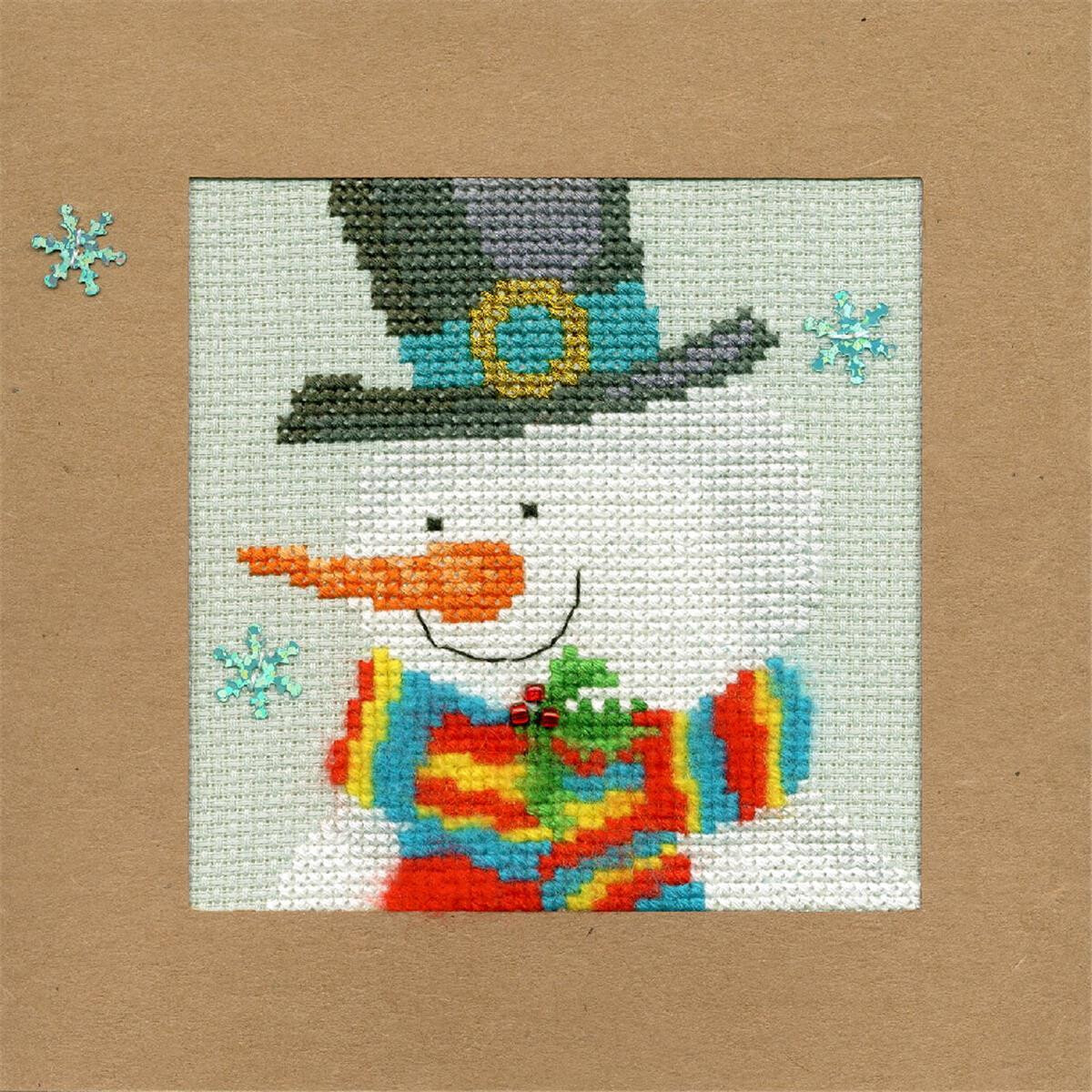 A colorful Bothy Threads embroidery pack snowman with a...