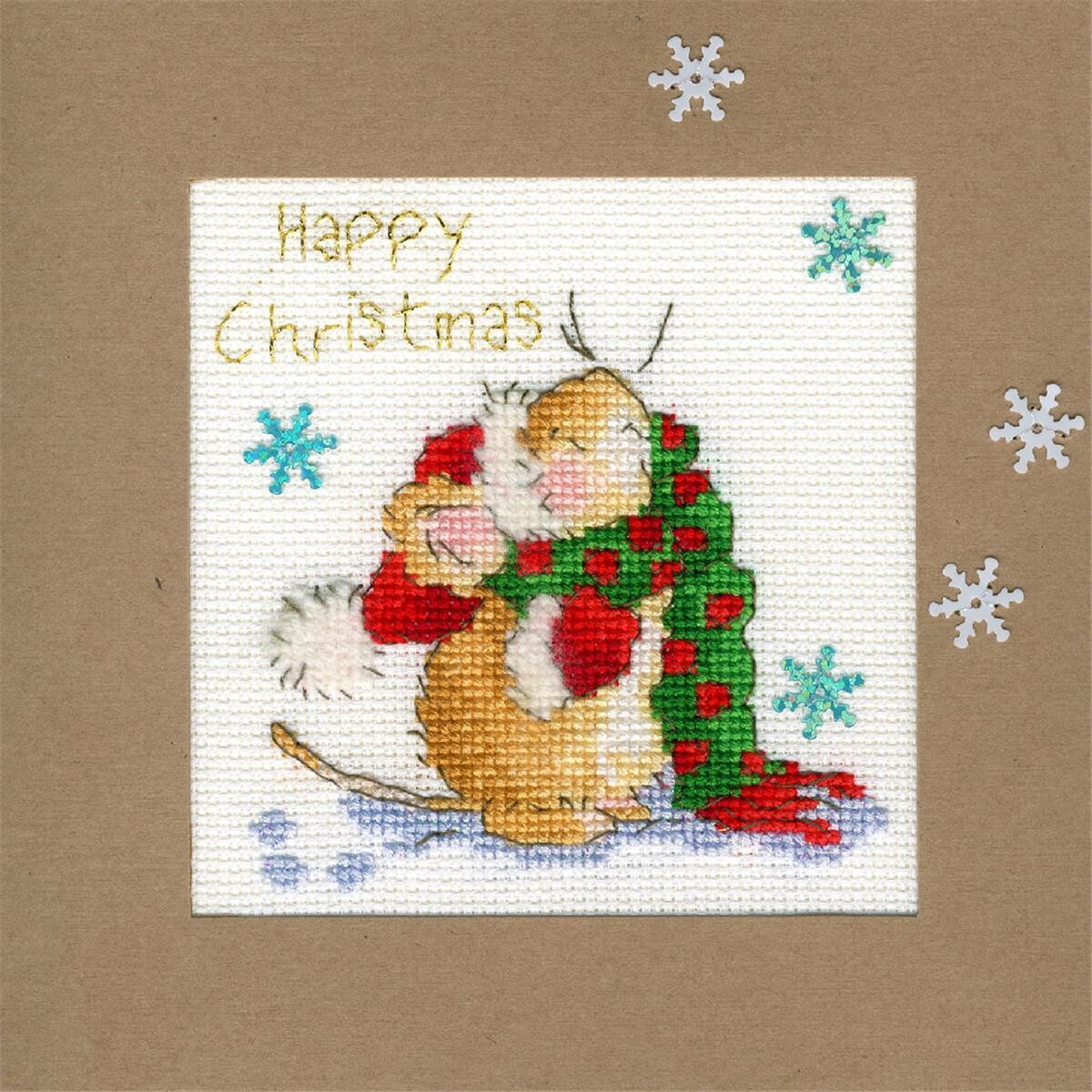 An embroidered Christmas card with a cute brown mouse in...