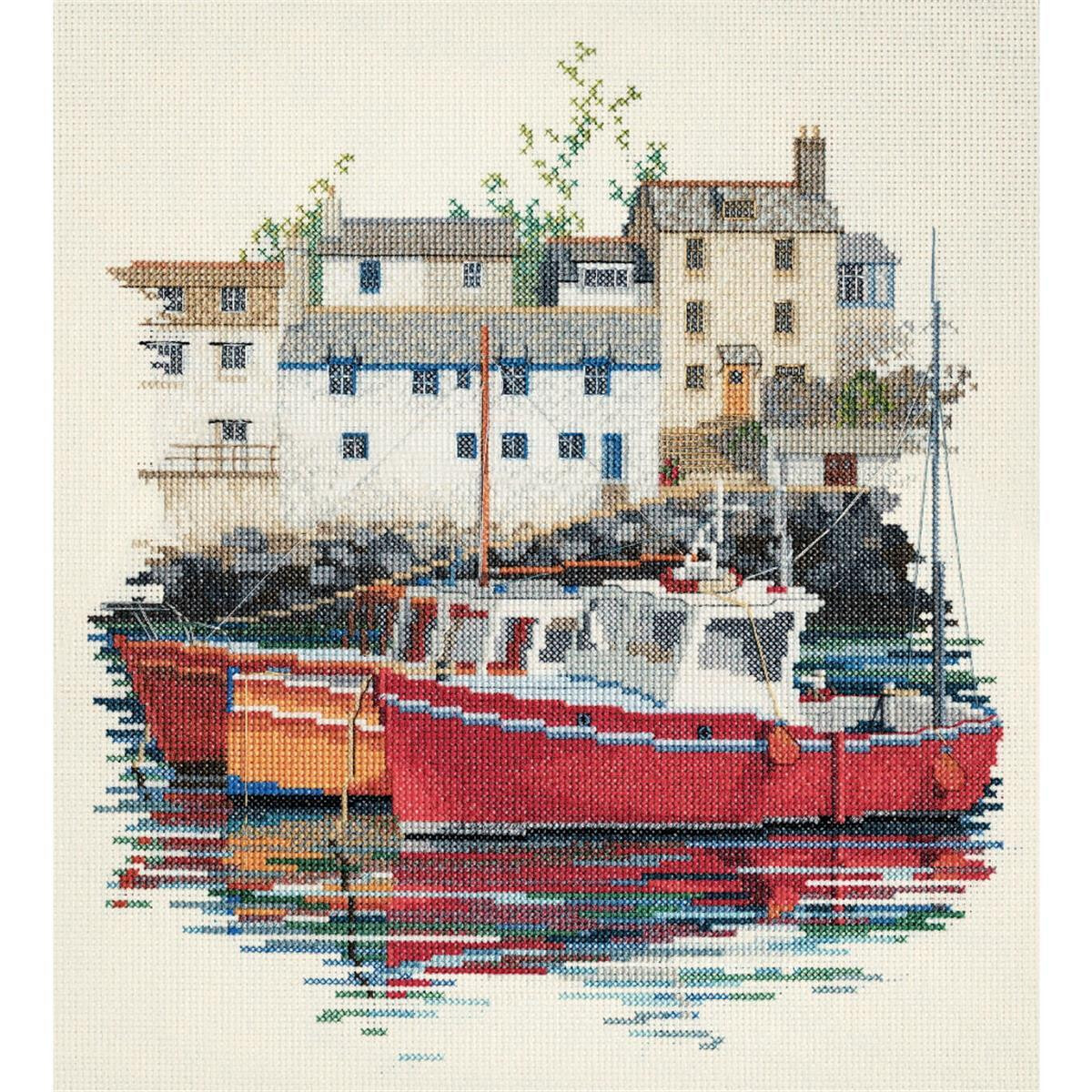 An embroidery pack from Bothy Threads shows two red boats...