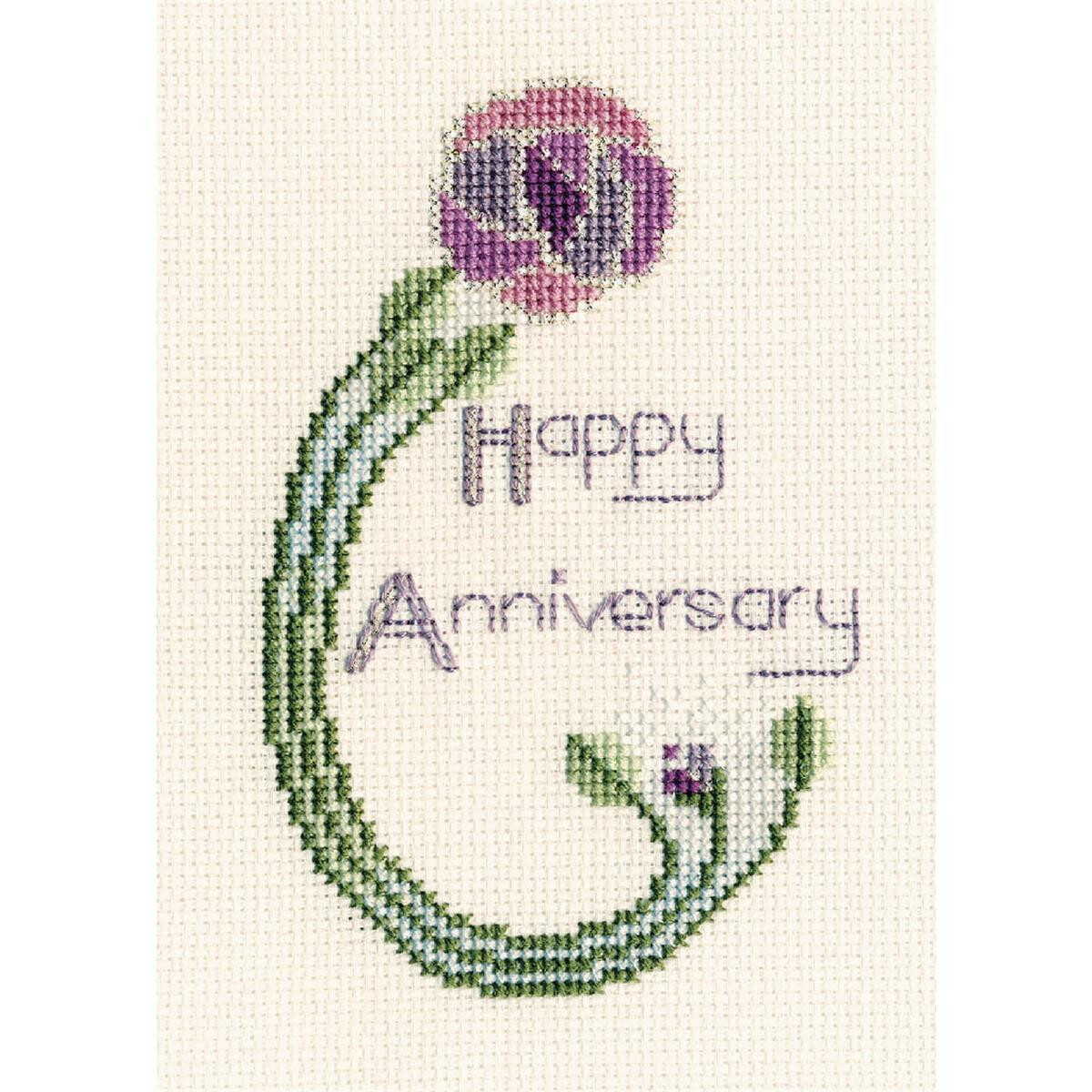 A hand embroidered Happy Anniversary design on white...