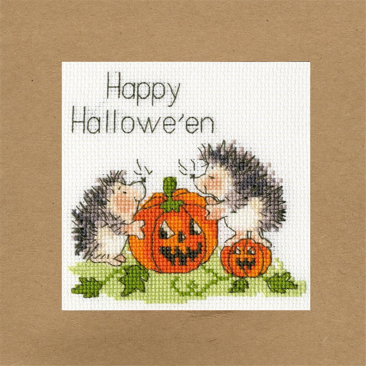 A Halloween card features two hedgehogs holding a large,...