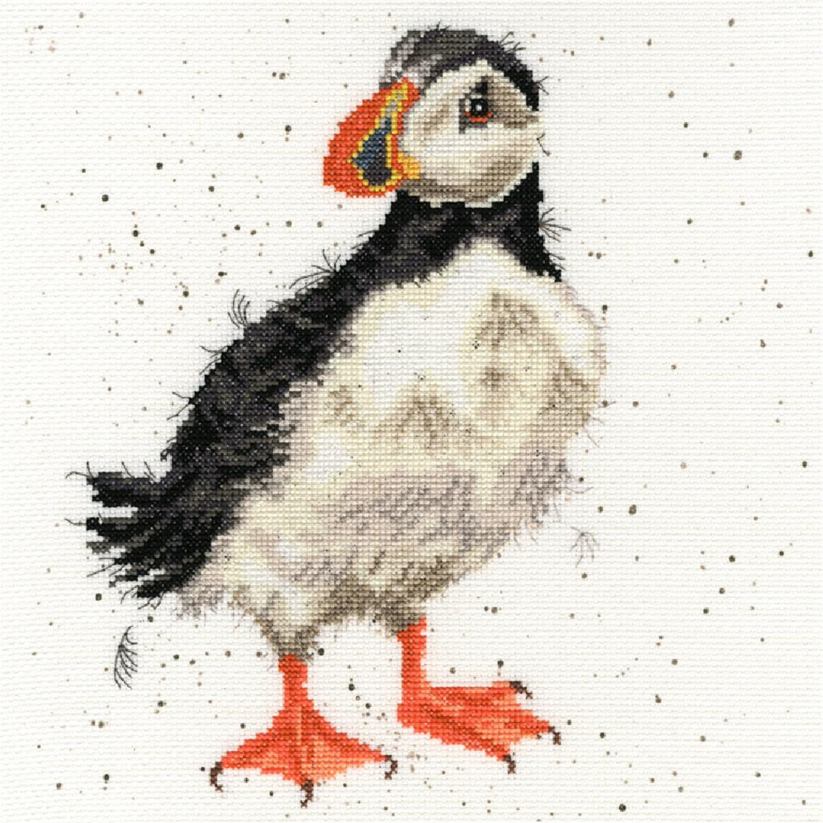 A detailed embroidery pack of a puffin on a white...