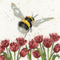 An embroidery pack from Bothy Threads shows a large bee hovering over a field of red tulips. The bee has a black and yellow body with translucent wings. The tulips have bright green stems and leaves, creating a colorful and vibrant scene against a white background with subtle decorative spots.