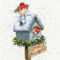 A festive embroidery design showing a snow-covered birdhouse with a robin on the roof and another robin peeping out of the entrance. The birdhouse is decorated with green plants and red berries. A sign hanging below reads SANTA, please stop here in red letters, perfect for any Bothy Threads stick pack fan.