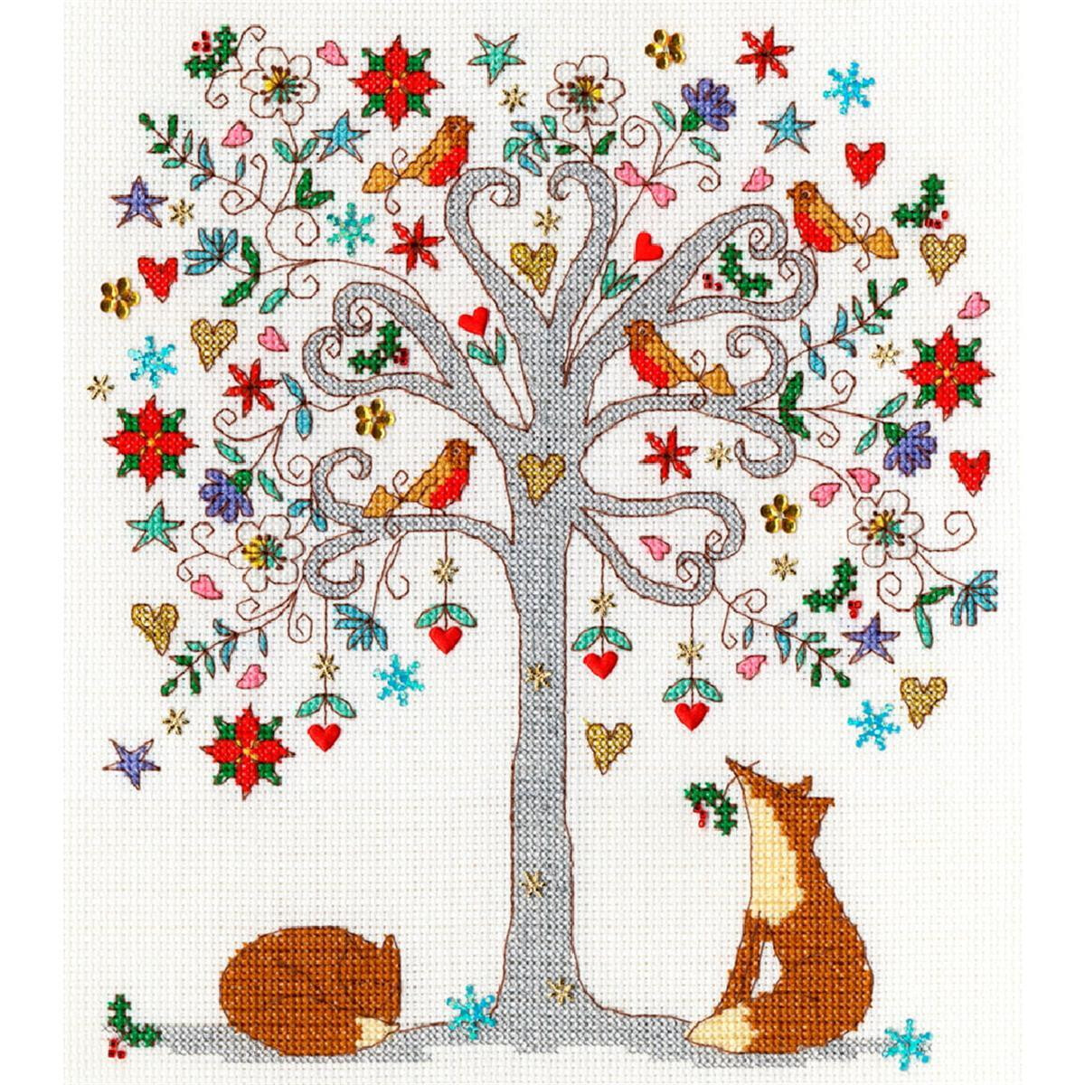A whimsical embroidered scene of a tree decorated with...