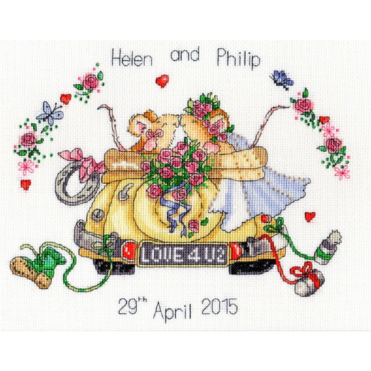 Cross stitch artwork of a newly married couple riding in...