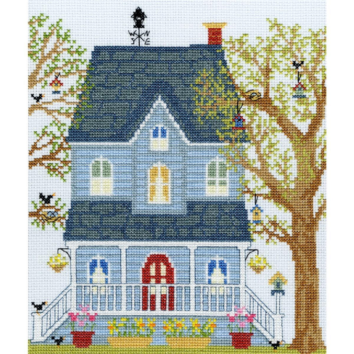 An embroidered pack of a charming blue house with a dark...