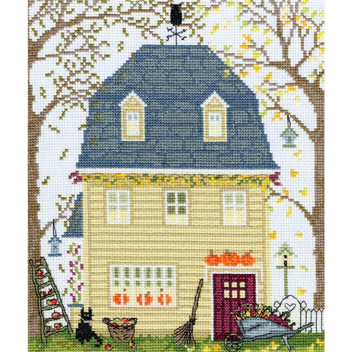 Embroidered picture of a yellow house with a steep blue...