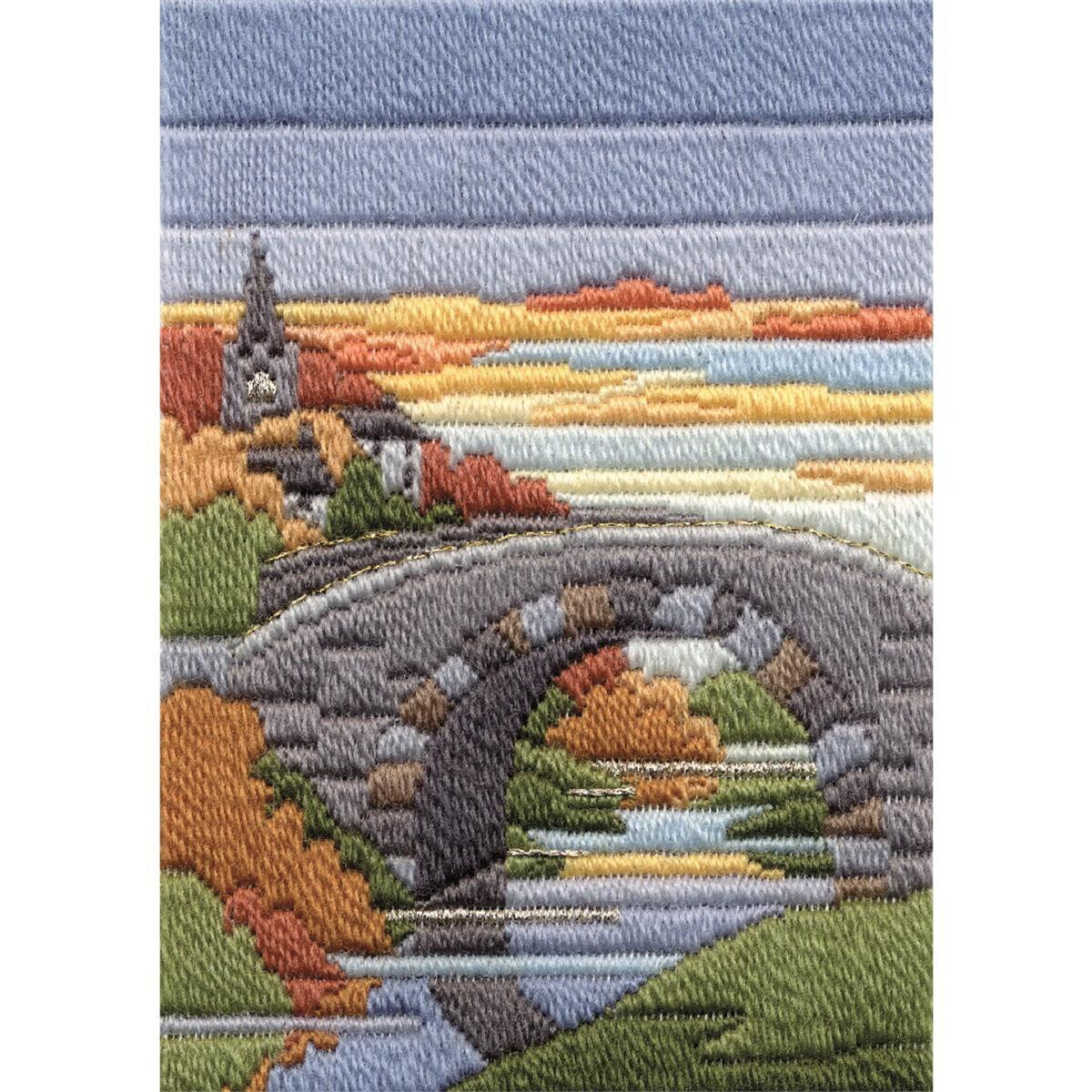 Вышитая сцена каменного моста через реку с разноцветными...