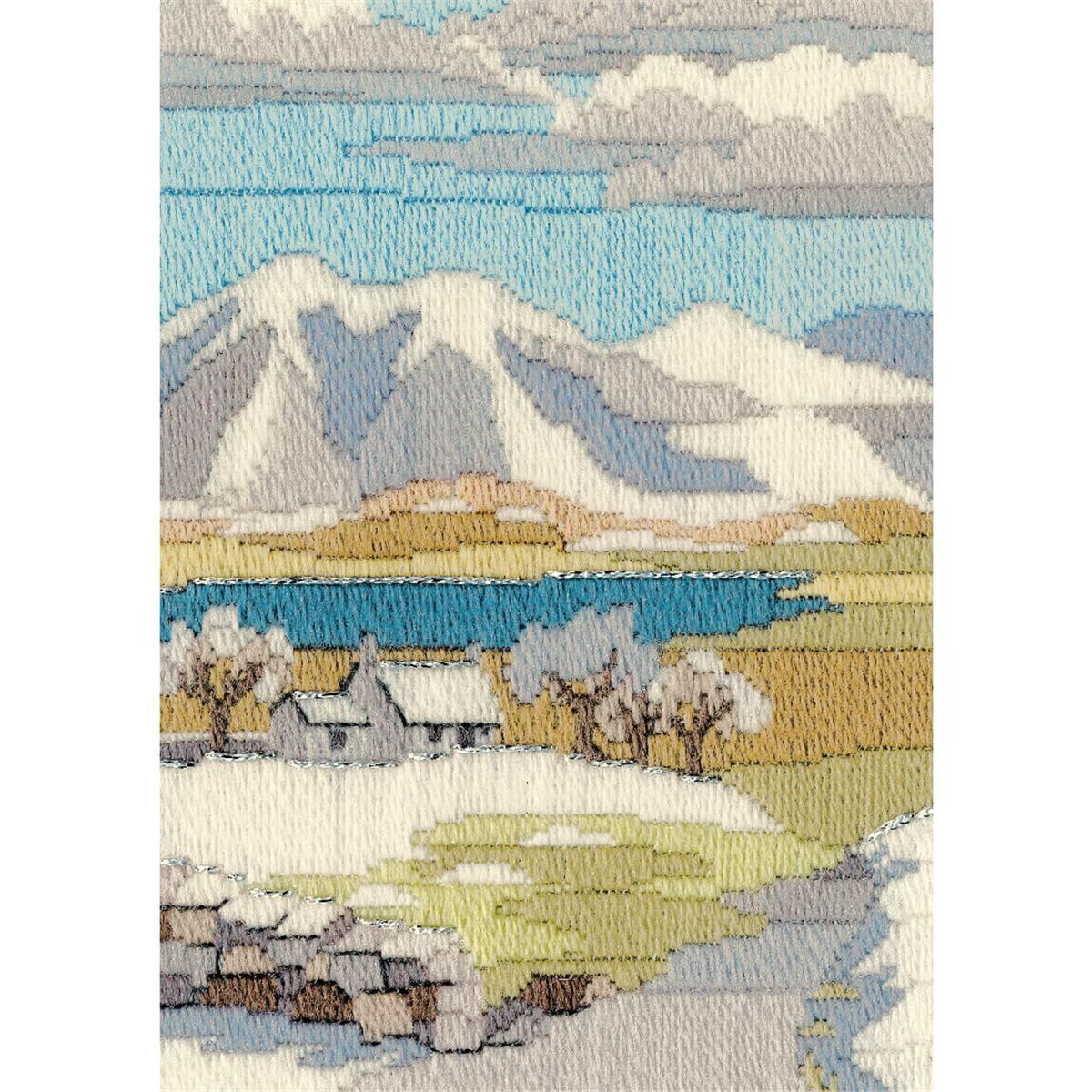 An intricately stitched picturesque landscape features...