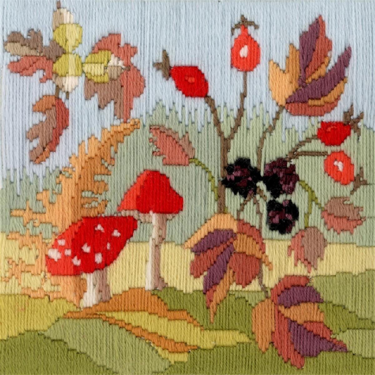 An intricately embroidered forest scene with red-capped...