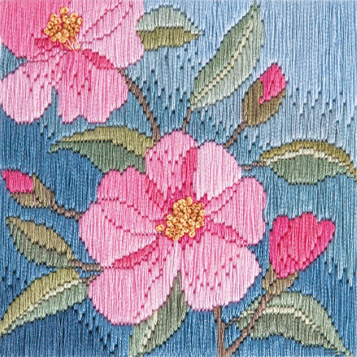Detailed embroidery of pink flowers with yellow centers...