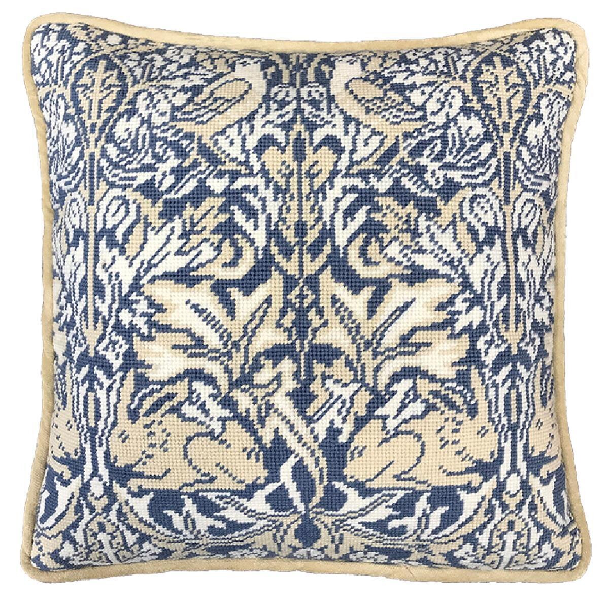 A square cushion with an intricate tapestry-like...