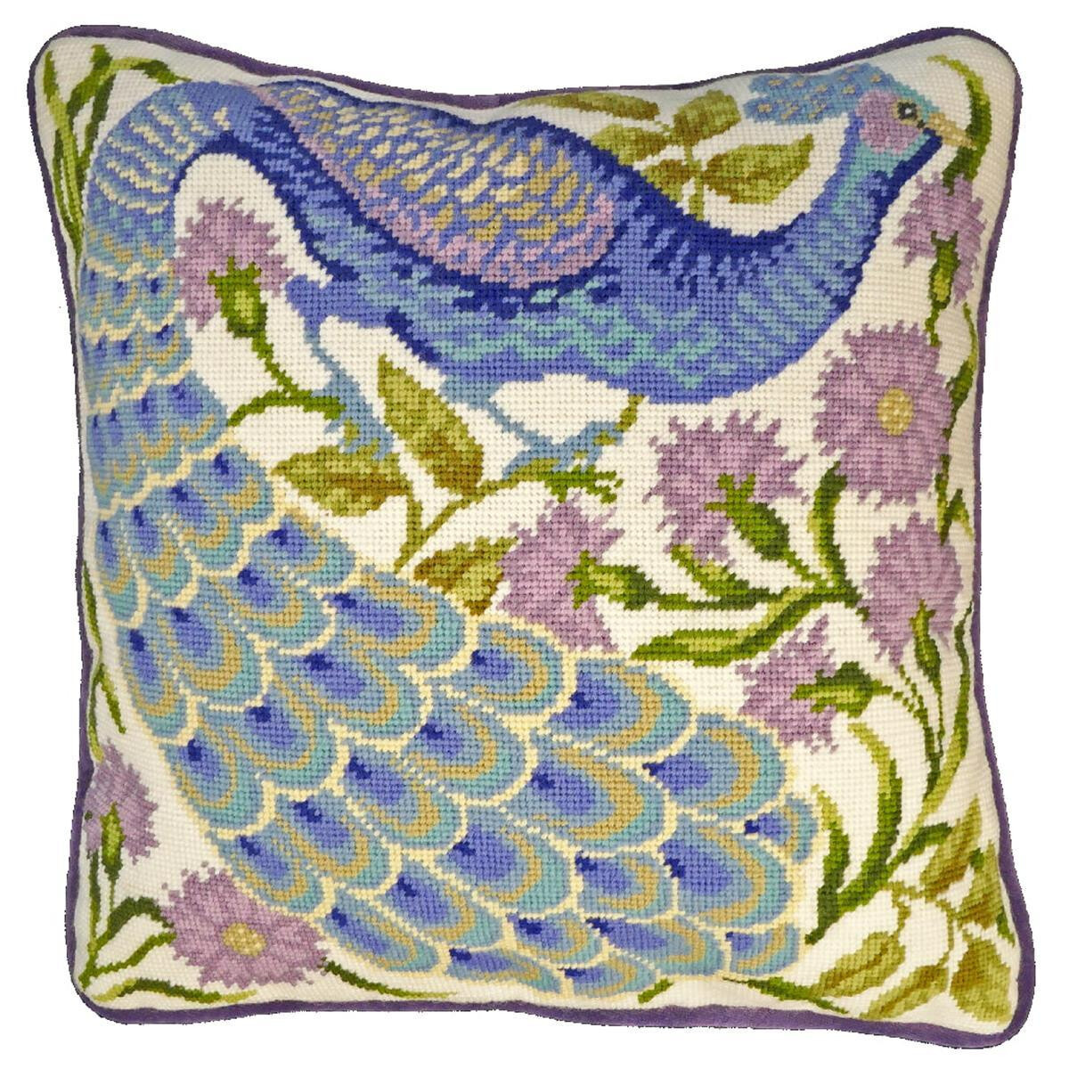A square cushion with a needlepoint pattern of a blue...