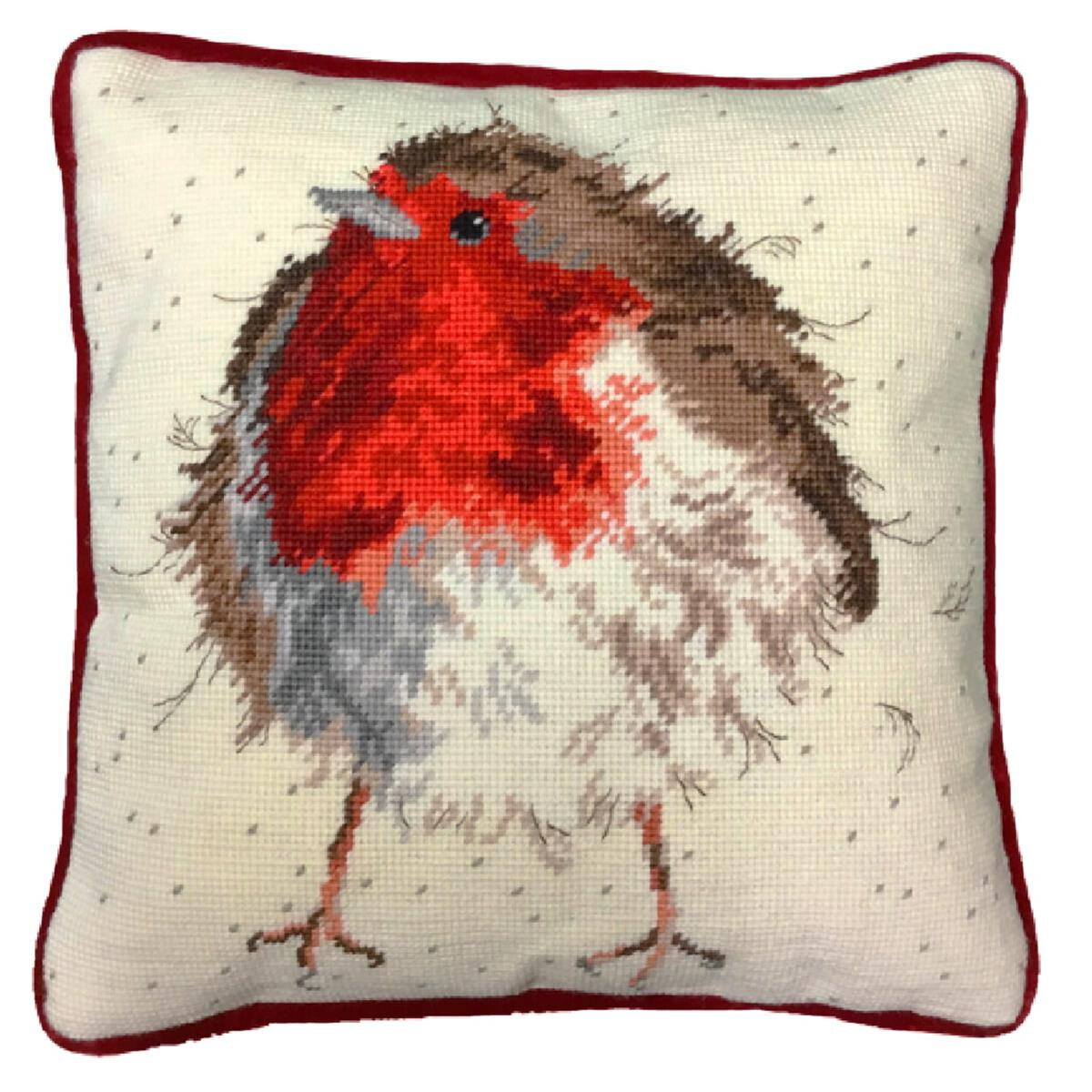 A square cushion with an embroidery pack design of a...