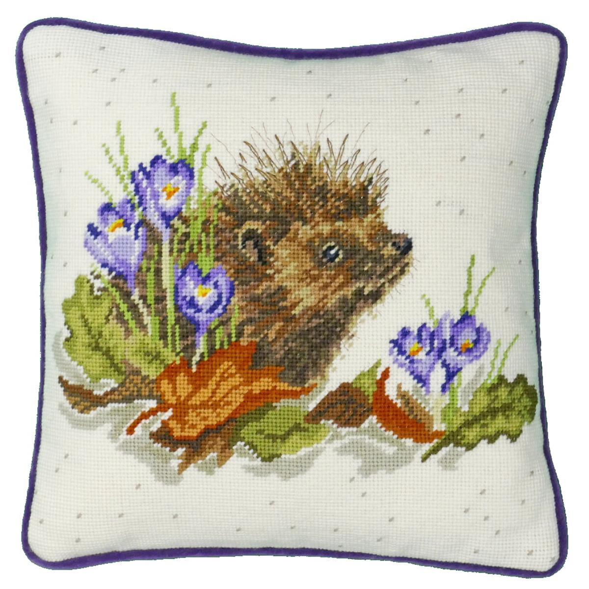 A square cushion with a purple border and an embroidery...