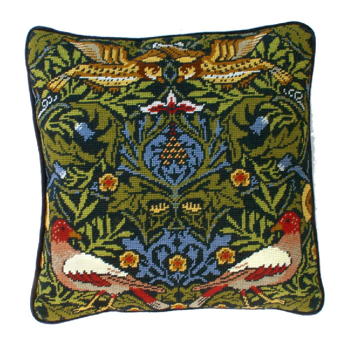 A square decorative cushion with an intricate embroidered...