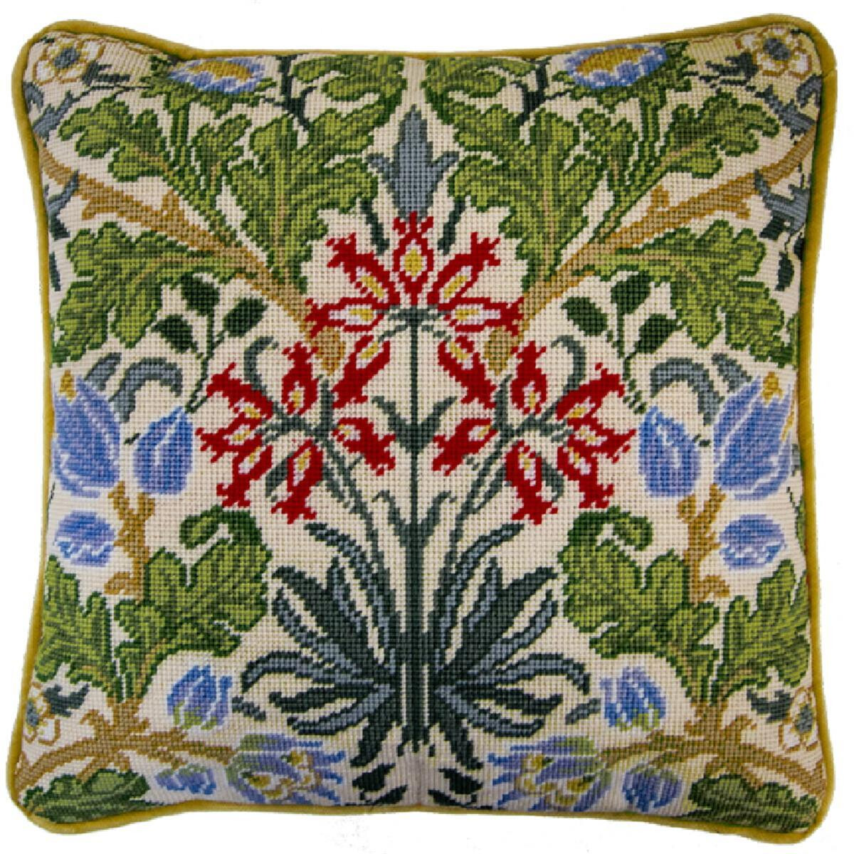 Square cushion with embroidered botanical design. The...