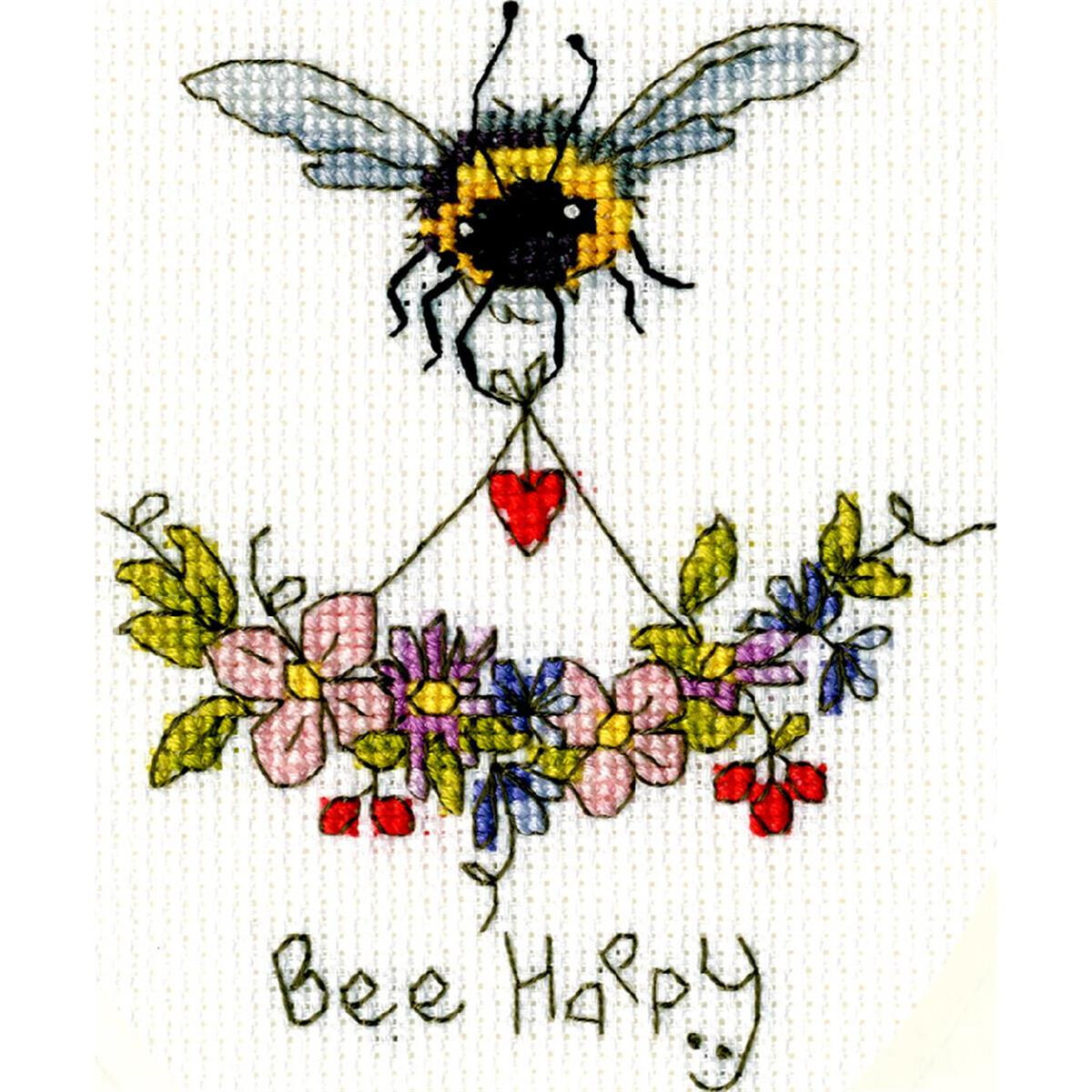 A bee with delicate wings embroidered in cross stitch...