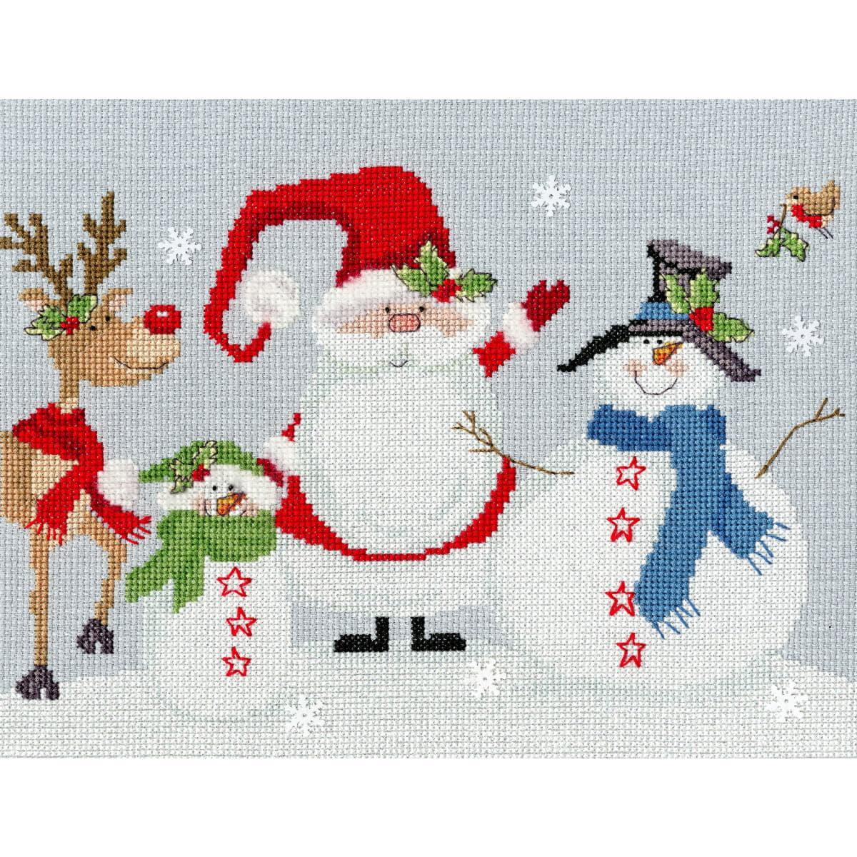 A festive scene with a cross stitch design featuring a...