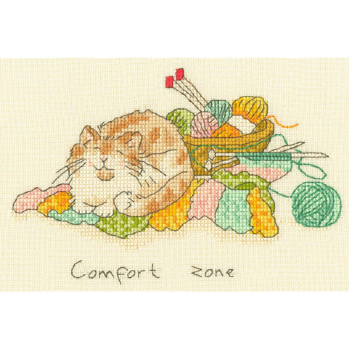 A cross-stitch picture shows a contented, fluffy orange...