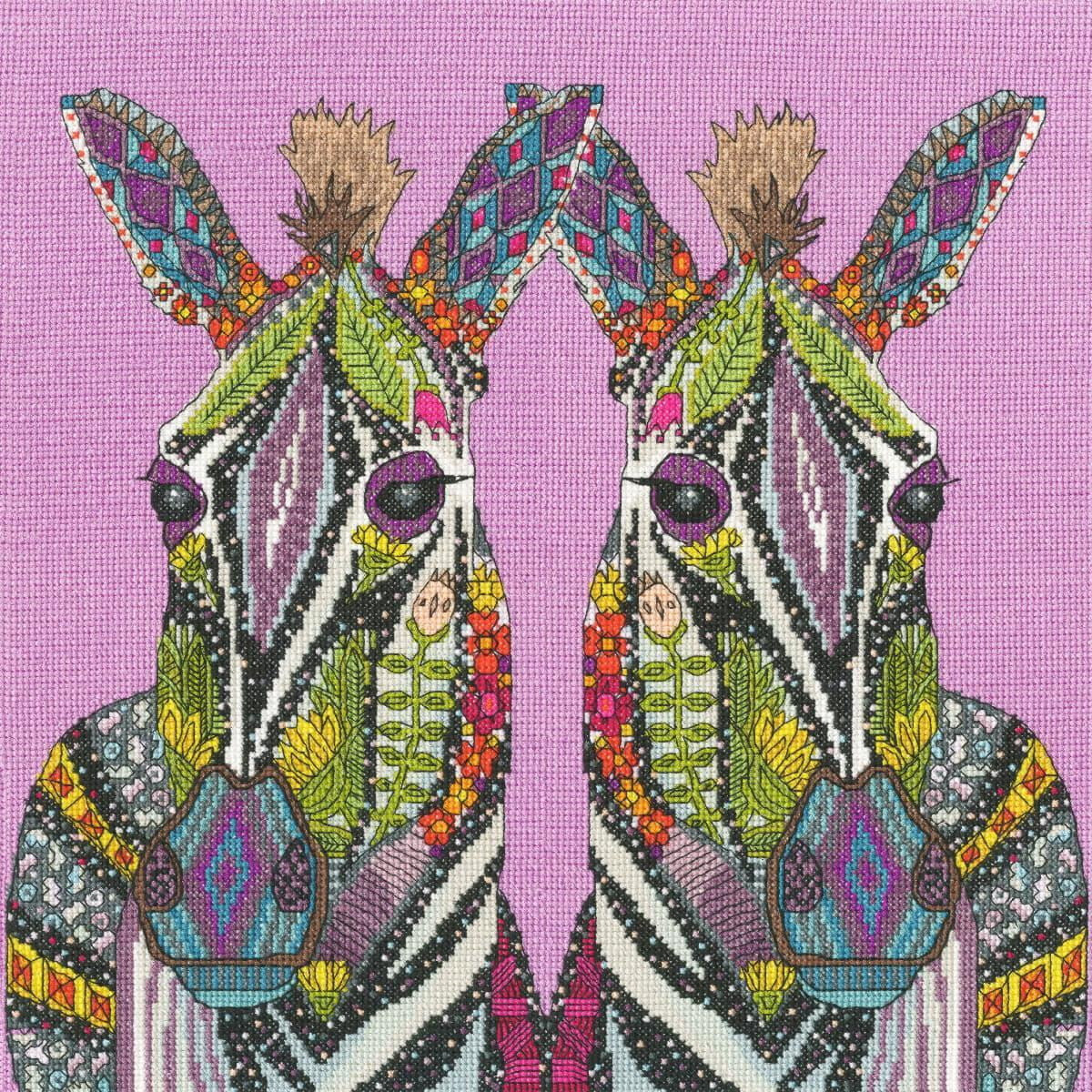 Two donkeys with intricate, colorful and patterned...