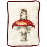 A rectangular cushion with a burgundy border features an embroidered design, an embroidered pack of Bothy Threads, of a little mouse sitting on a red and white spotted mushroom. The background is cream with scattered small dots creating a dotted effect. The mouse has delicate whiskers and a long tail.