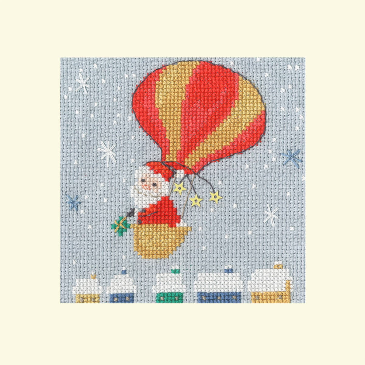 A Bothy Threads embroidery pack shows Santa Claus flying...