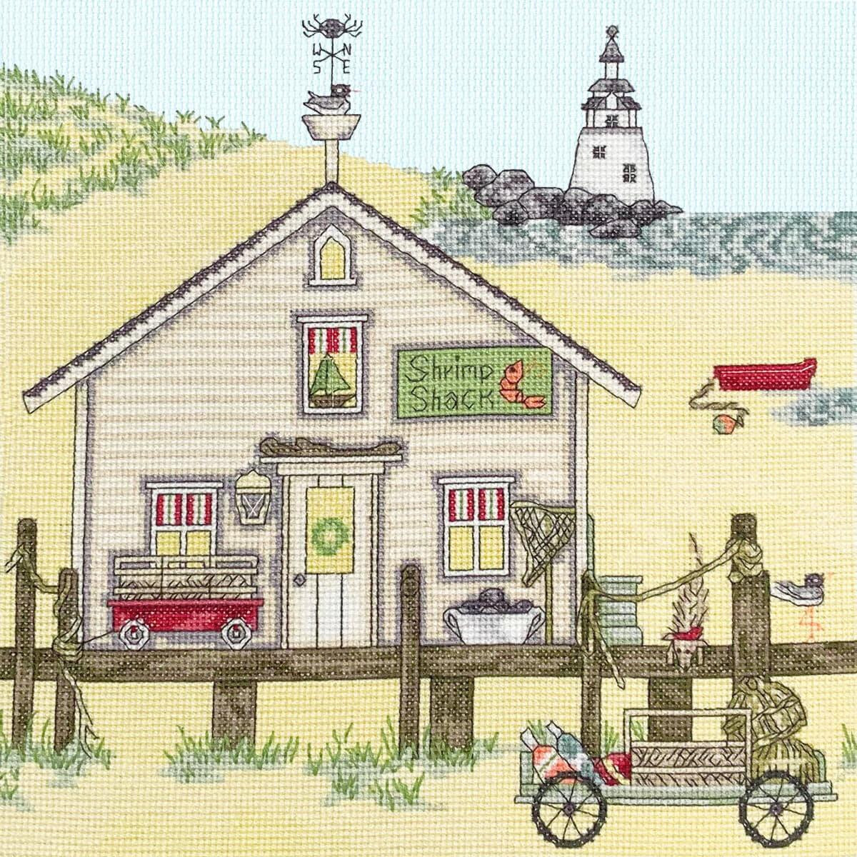 Embroidery of a coastal scene with a rustic hut with the...