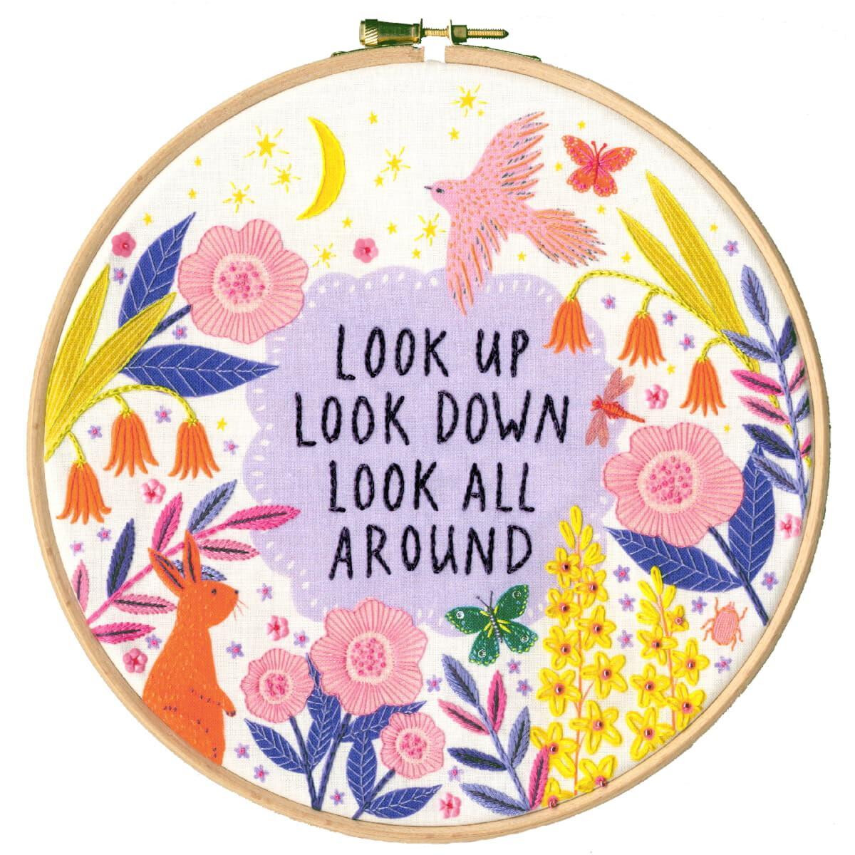 A decorative embroidery hoop with colorful flower...