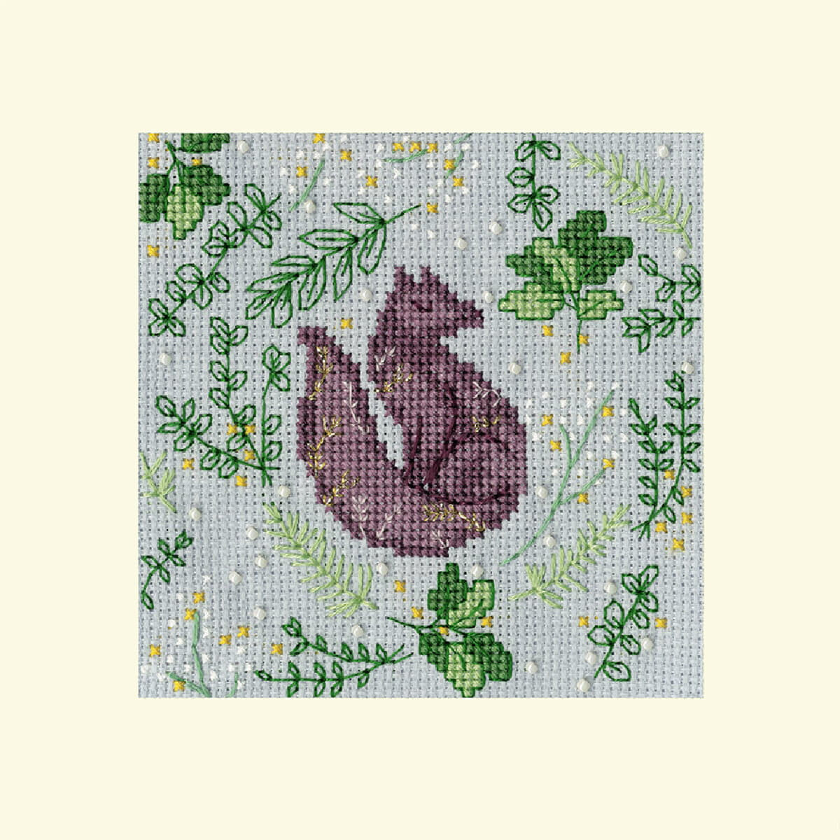 Cross stitch of a purple squirrel sitting on its hind...