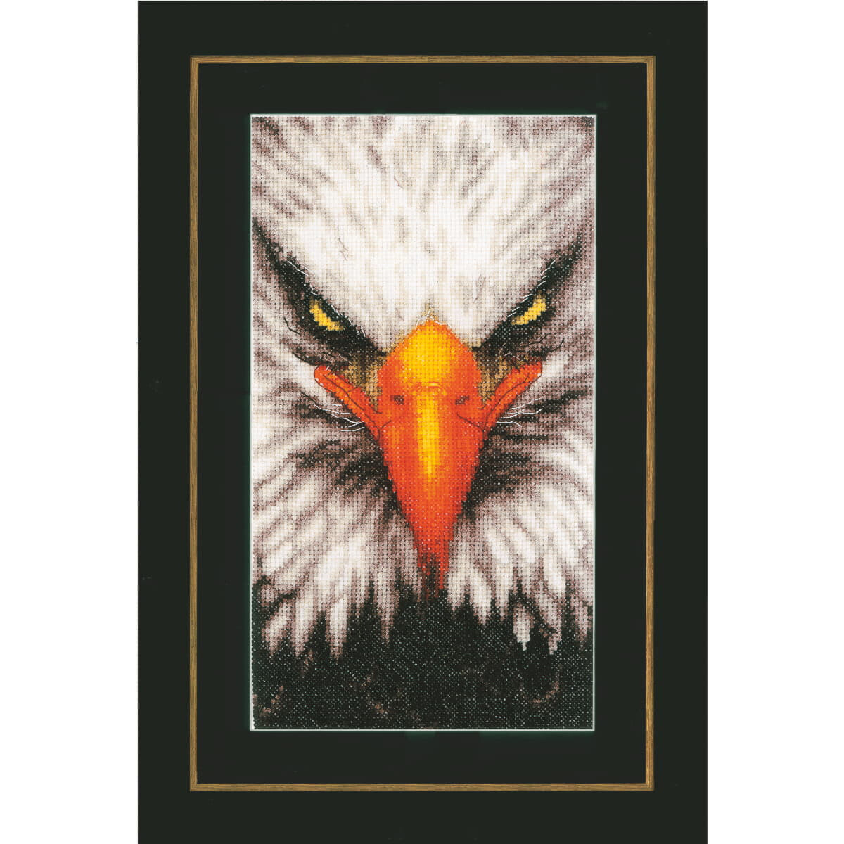 A detailed embroidery of a bald eagles face is centered...