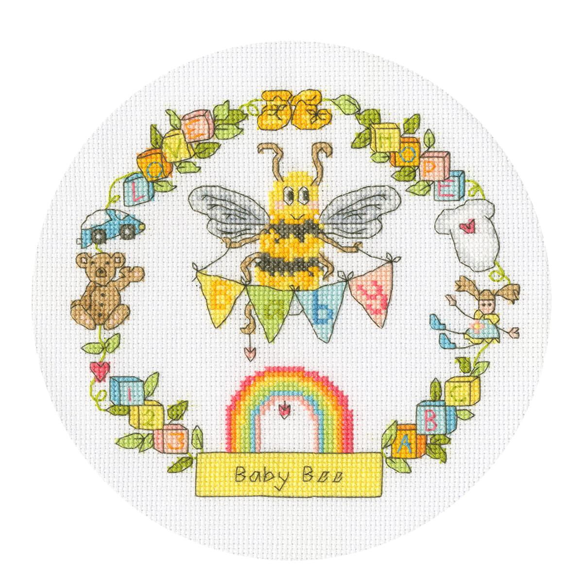 A circular cross stitch pattern or embroidery pack with a...