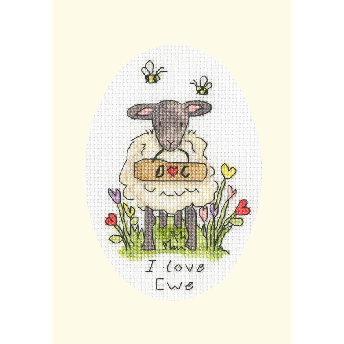An embroidered embroidery pack with a sheep stands in a...