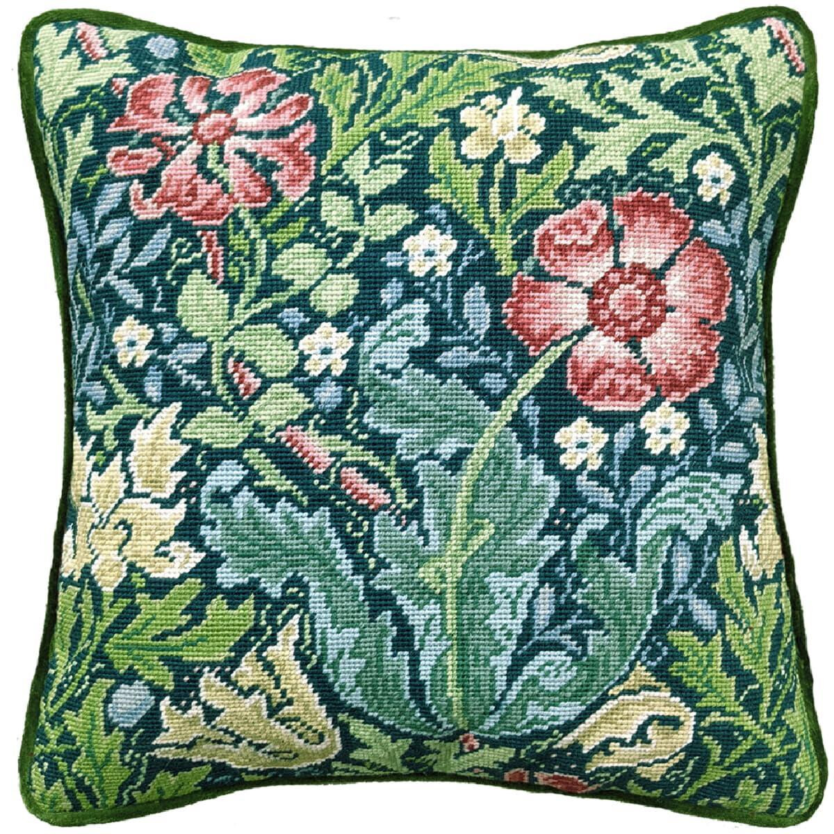 A square decorative cushion with embroidery pack...